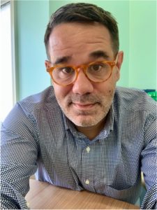 James sitting at desk